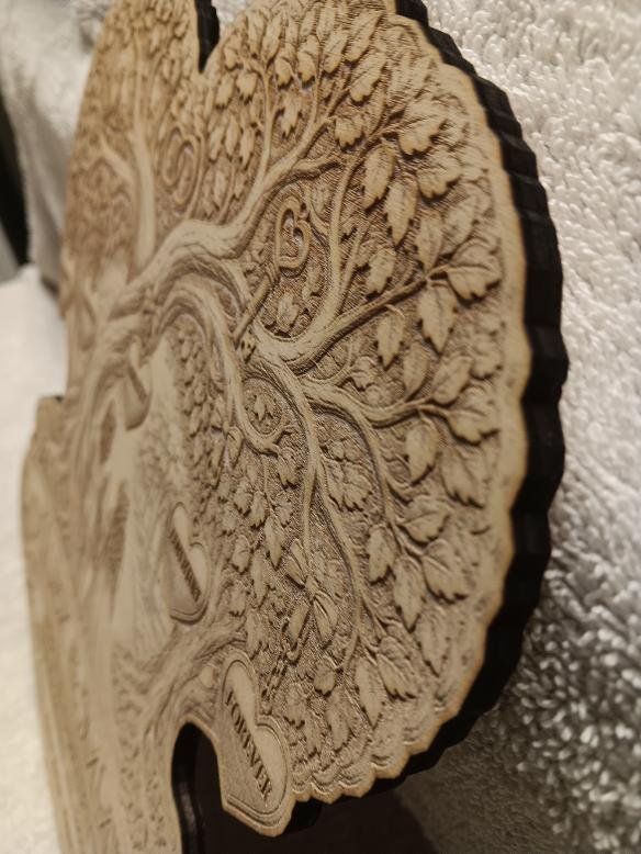 Close-up of the wedding plaque's engraved details and quarter-inch-thick edge