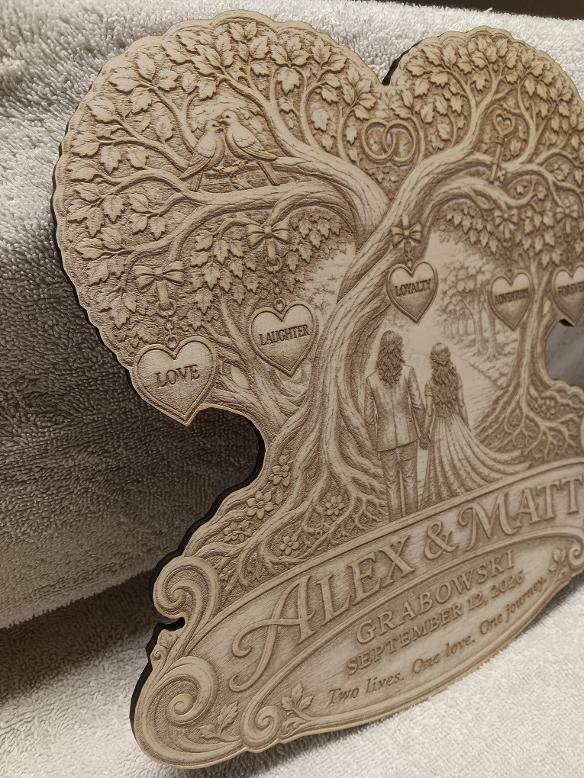 Angled view showing the engraved tree, hanging hearts and personalized nameplate